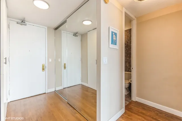 a view of a livingroom with wooden floor