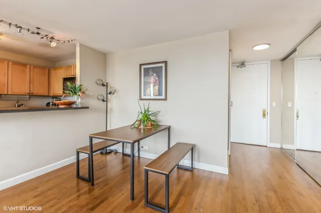 a view of a dining room with furniture and wooden floor