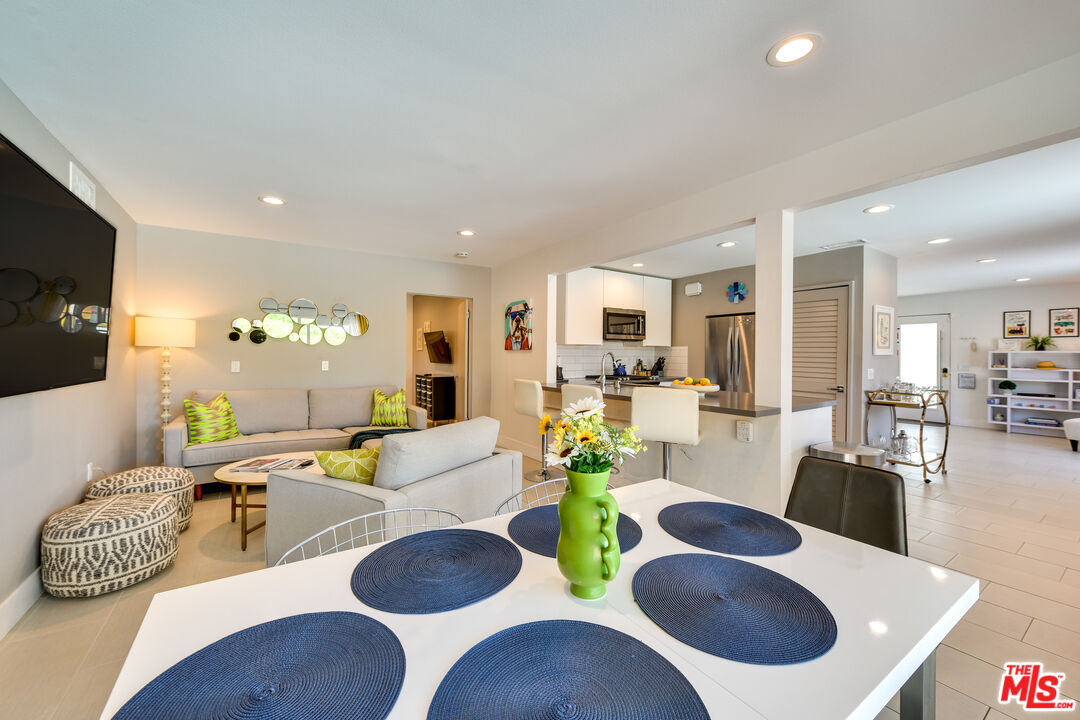 2146 North Blando Road Palm Springs, CA 92262 - Photo 12 of 31 a living room with kitchen island furniture and a wooden floor