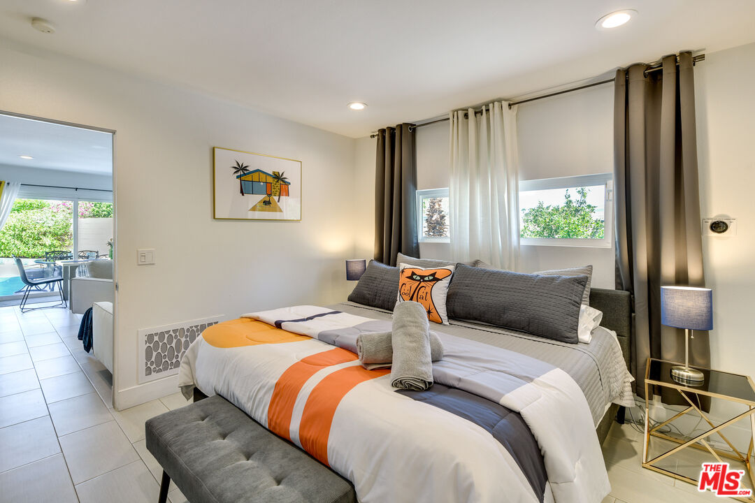 2146 North Blando Road Palm Springs, CA 92262 - Photo 13 of 31 a bedroom with a bed and a window