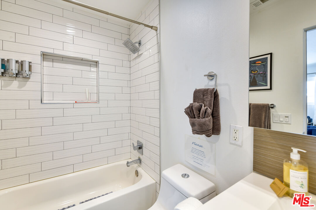 2146 North Blando Road Palm Springs, CA 92262 - Photo 17 of 31 a bathroom with a bathtub and shower