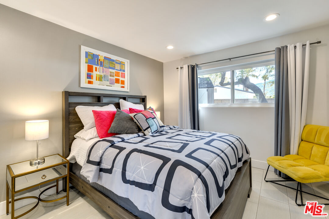 2146 North Blando Road Palm Springs, CA 92262 - Photo 18 of 31 a bedroom with a bed and wooden floor