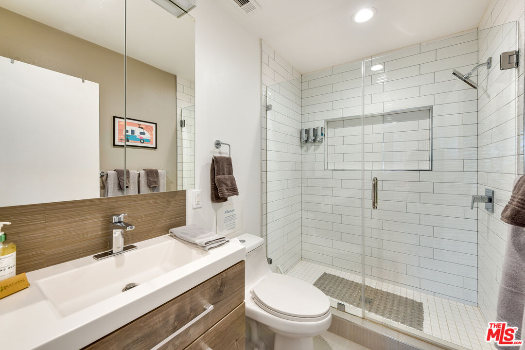 2146 North Blando Road Palm Springs, CA 92262 - Photo 19 of 31 a bathroom with a sink a toilet and shower