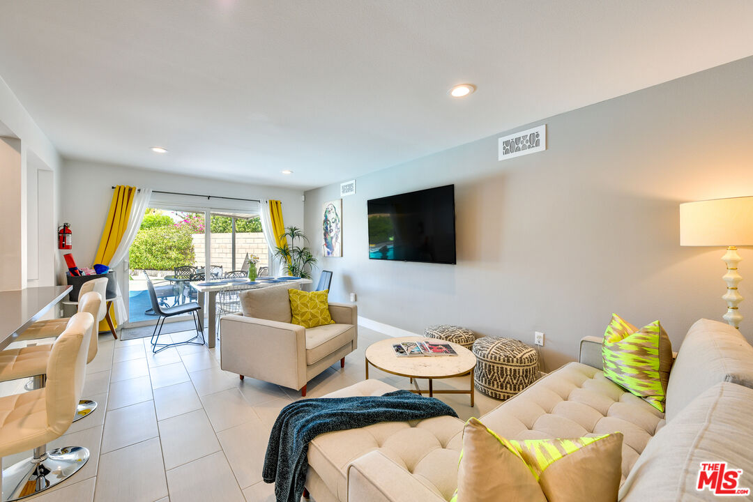 2146 North Blando Road Palm Springs, CA 92262 - Photo 10 of 31 a living room with furniture and a flat screen tv