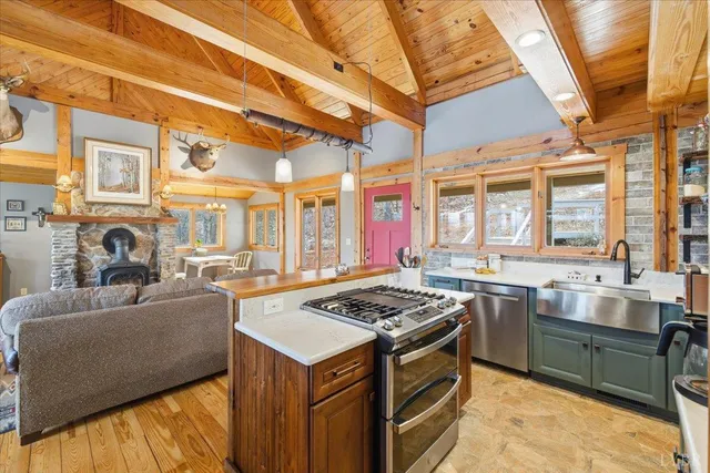 a view of an empty room with a fireplace