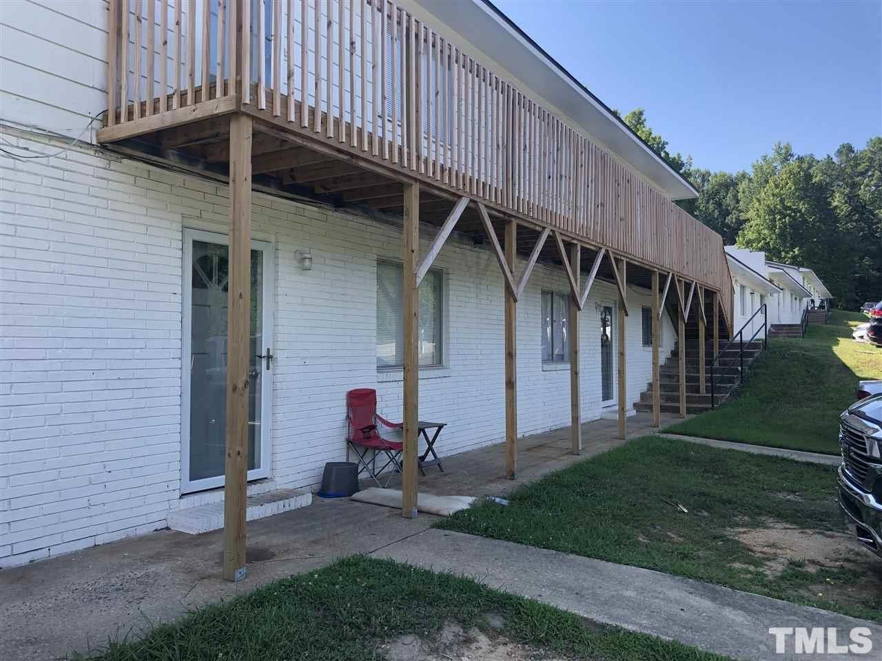 1400 Creech Road, Unit 4 Garner, NC 27529 - Photo 11 of 13 a view of a house with backyard and porch