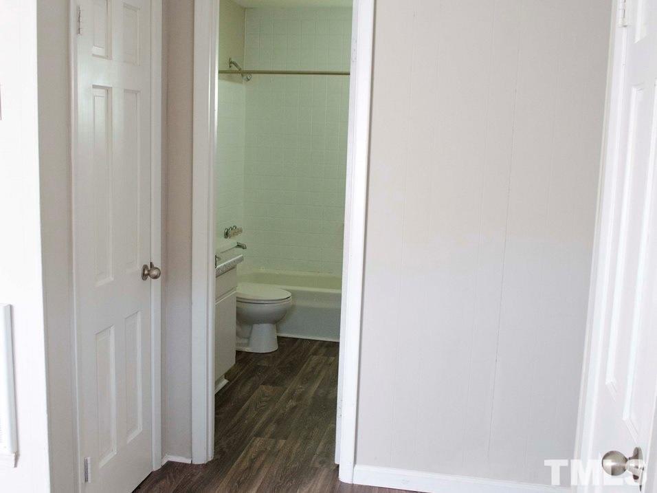 1400 Creech Road, Unit 4 Garner, NC 27529 - Photo 5 of 13 a bathroom with a toilet