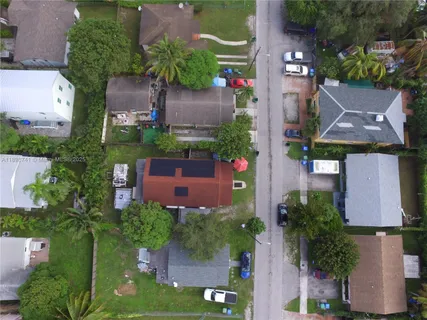 an aerial view of a house with a garden
