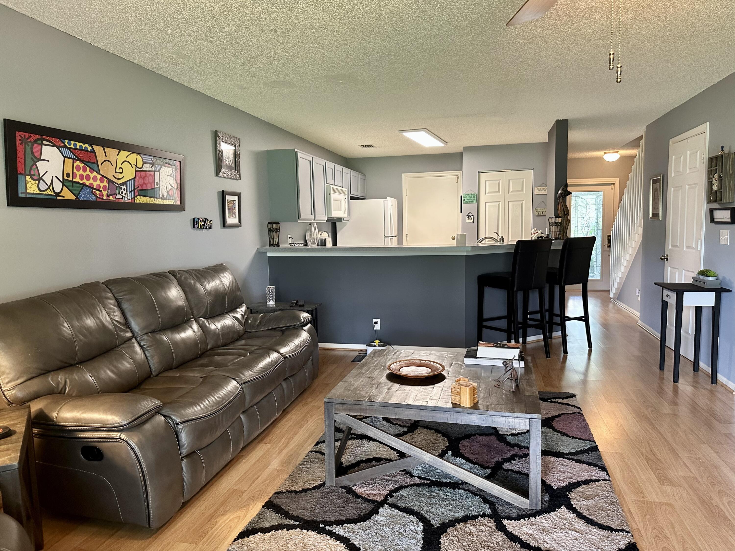 188 Timberwalk Trail Jupiter, FL 33458 - Photo 4 of 6 a living room with furniture and a flat screen tv