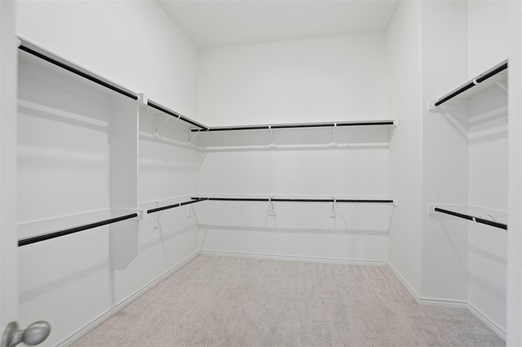 537 Oakmoss Street Little Elm, TX 76227 - Photo 15 of 39 a view of an empty walk in closet