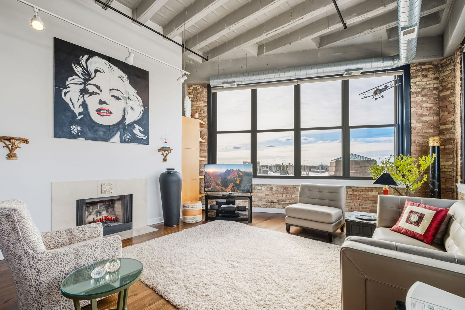 1601 West School Street, Unit 511 Chicago, IL 60657 - Photo 4 of 23 a living room with furniture and a fireplace