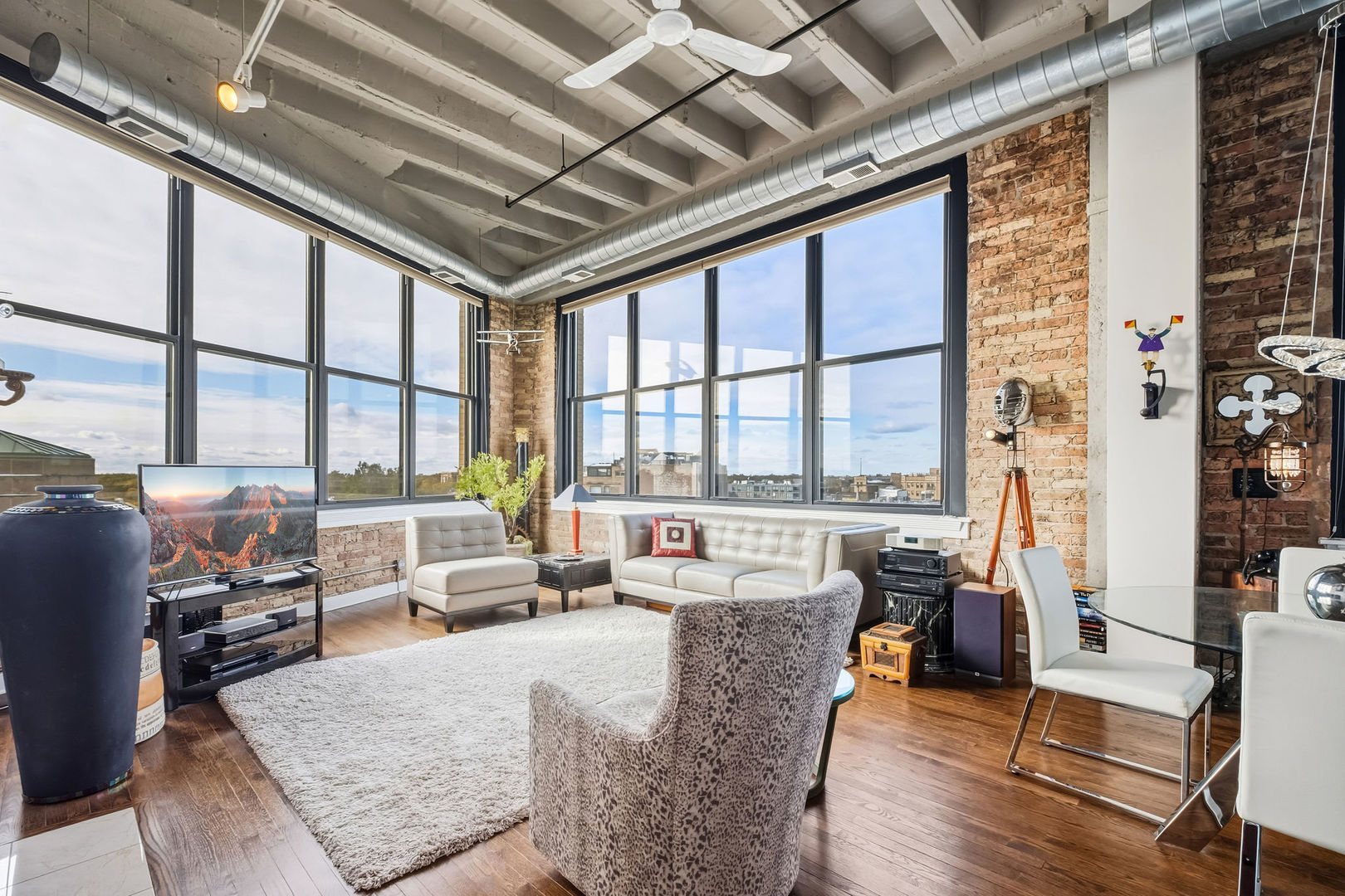1601 West School Street, Unit 511 Chicago, IL 60657 - Photo 5 of 23 a living room with furniture large windows and wooden floor
