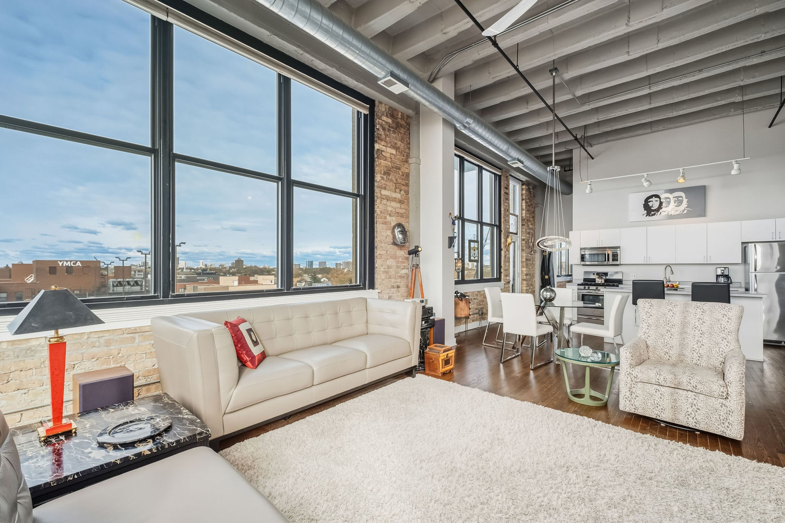 1601 West School Street, Unit 511 Chicago, IL 60657 - Photo 6 of 23 a living room with furniture and a large window