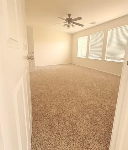 a bathroom with a tub shower and a sink