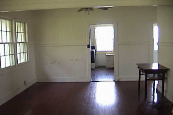 48-5200 Honokaa-Waipio Road Honokaa, HI 96727 - Photo 3 of 3 wooden floor in an empty room with a window