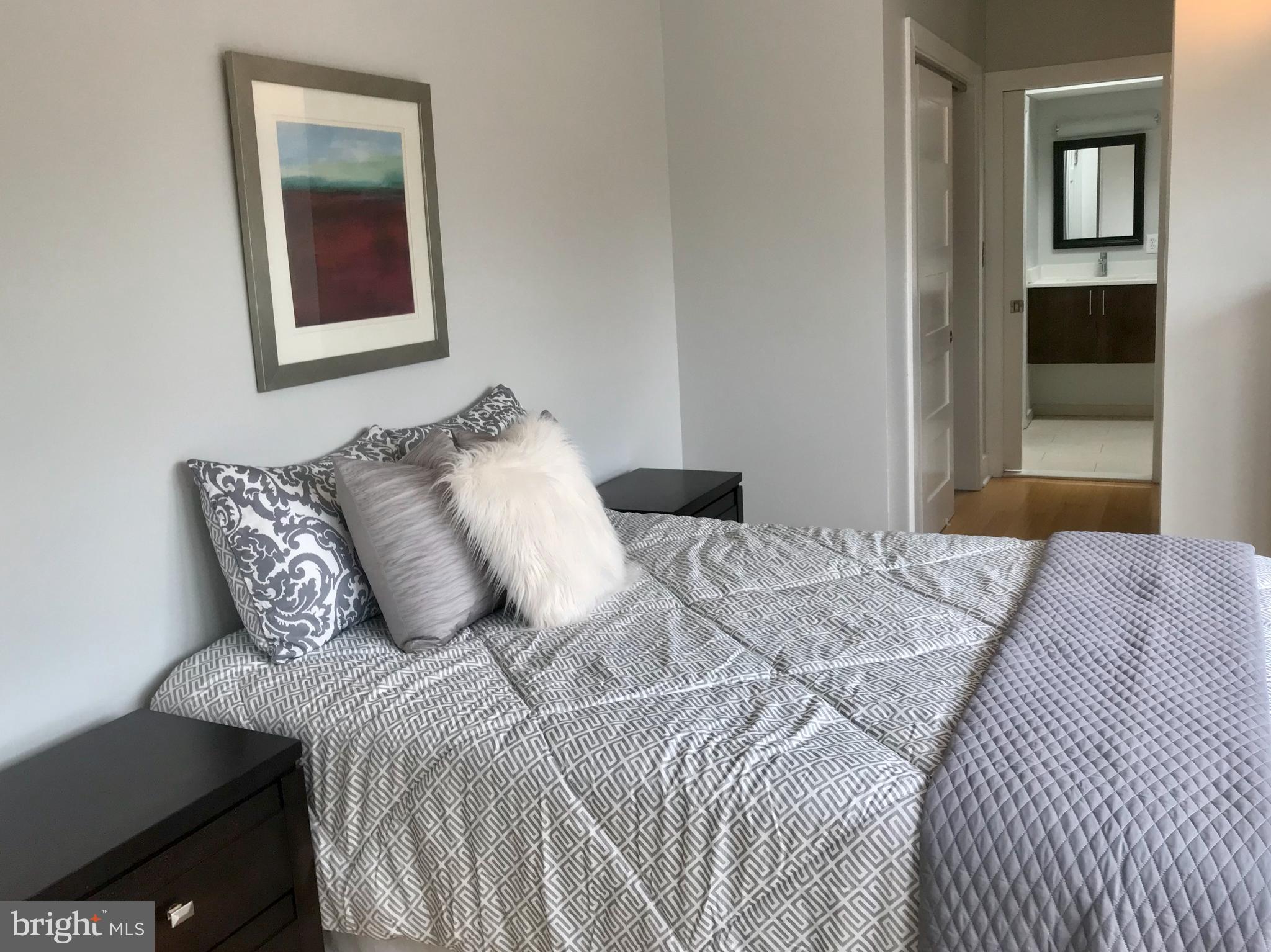 906 G Street Southeast Washington, DC 20003 - Photo 11 of 28 a bedroom with bed and window