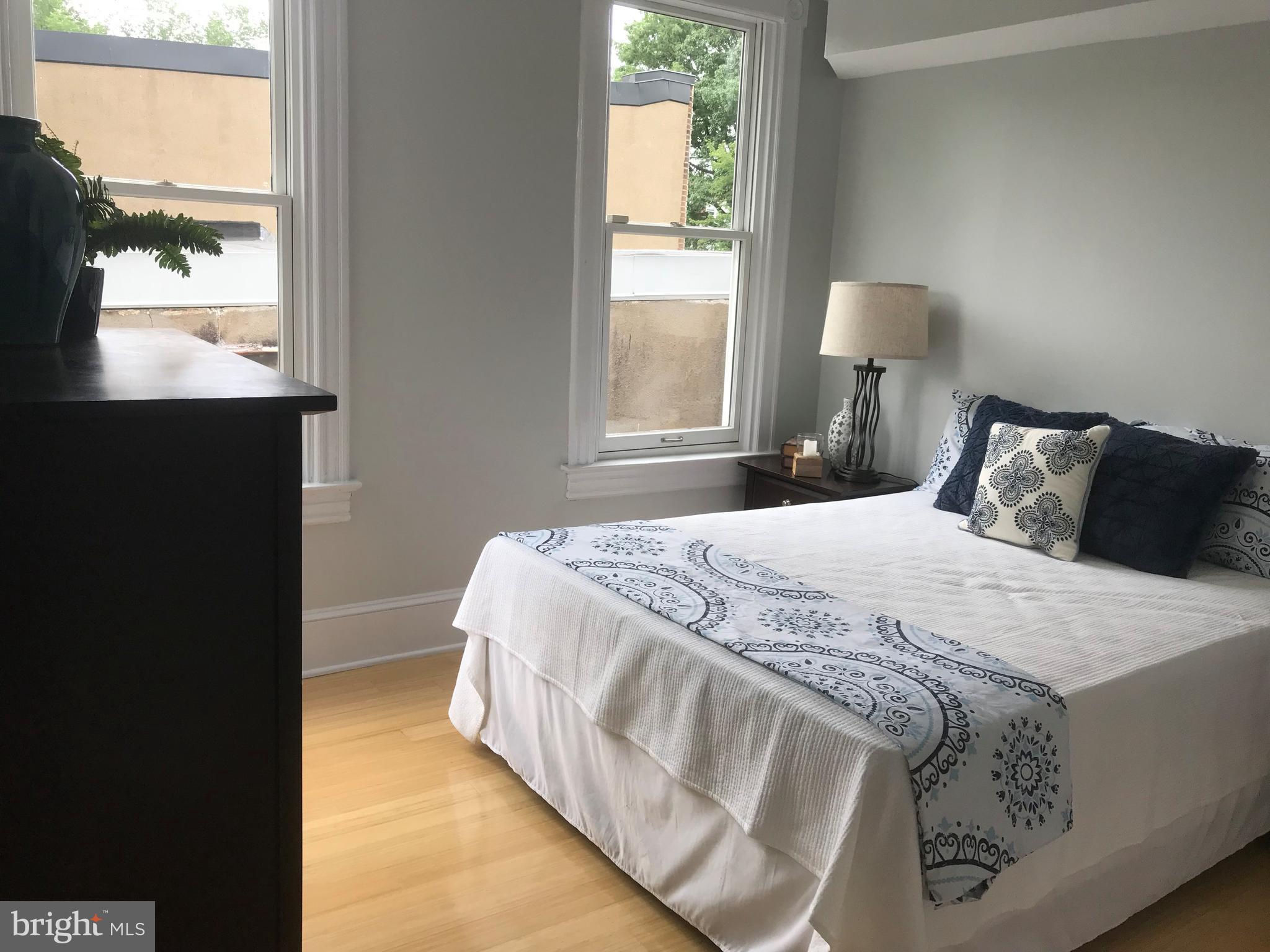906 G Street Southeast Washington, DC 20003 - Photo 17 of 28 a bedroom with a bed and a window