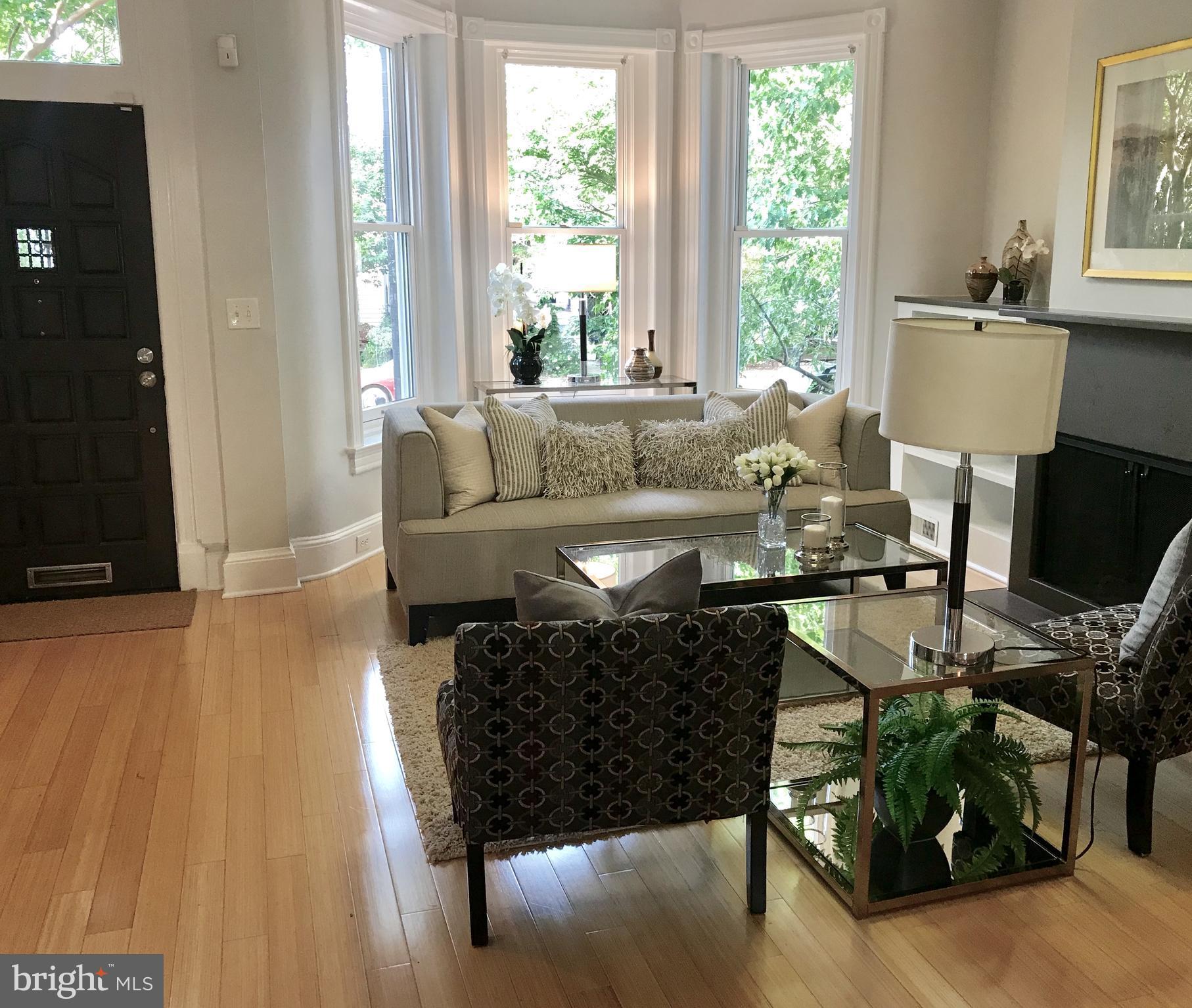 906 G Street Southeast Washington, DC 20003 - Photo 3 of 28 a living room with furniture a window and a flat screen tv