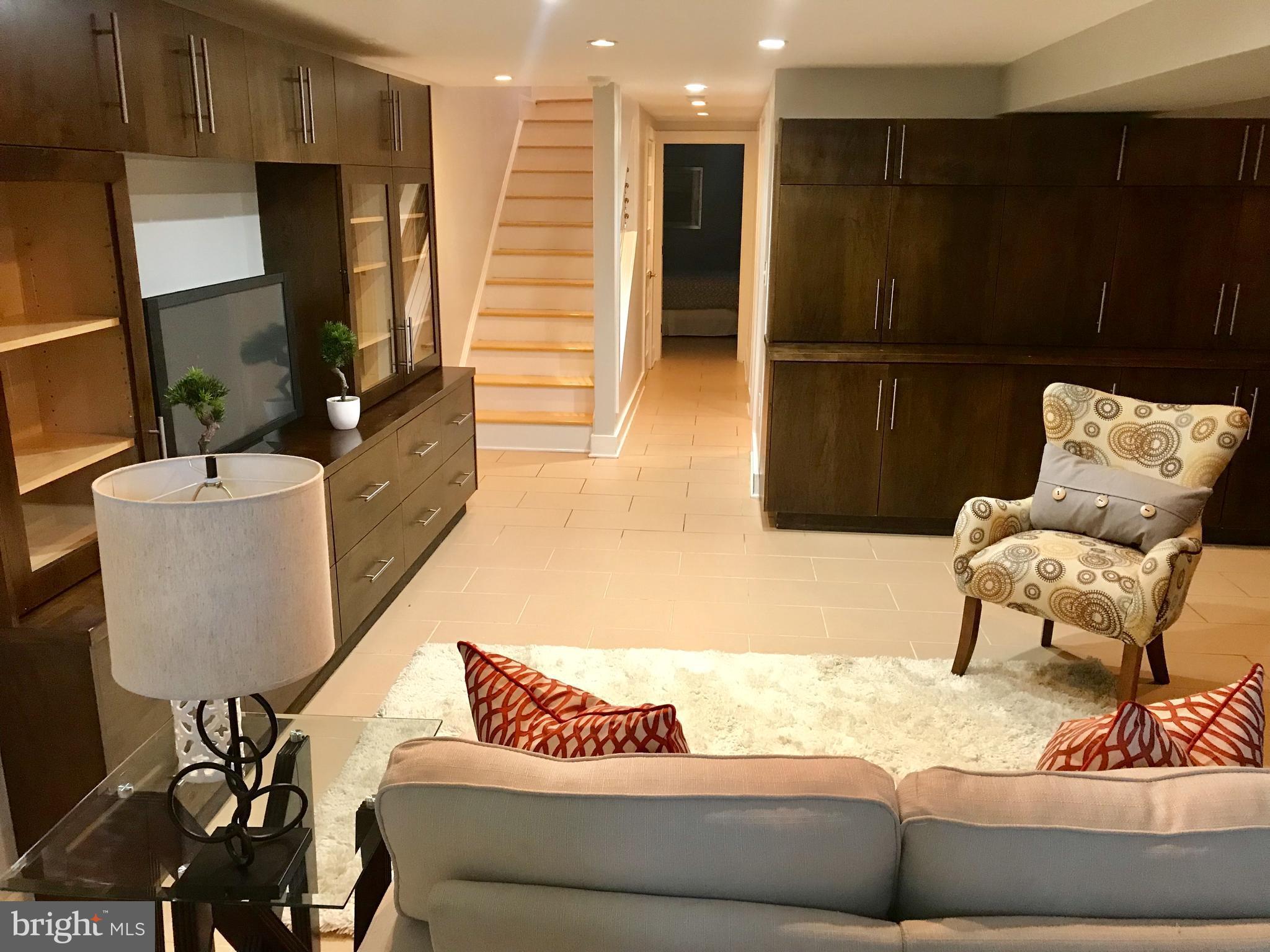 906 G Street Southeast Washington, DC 20003 - Photo 23 of 28 a living room with furniture and a flat screen tv