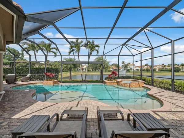 a view of a backyard with sitting area