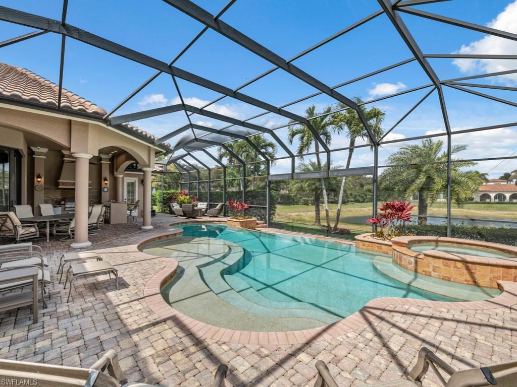 16509 Cellini Lane Naples, FL 34110 - Photo 2 of 49 a view of a swimming pool with a patio