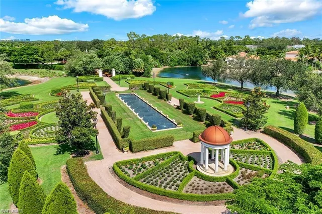a view of a swimming pool with a yard