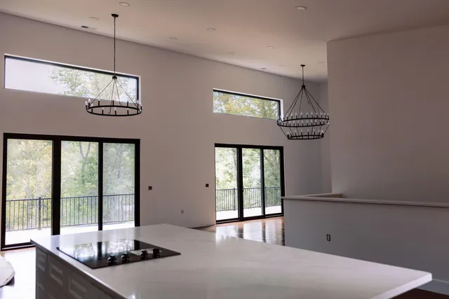 a view of a room with furniture and window