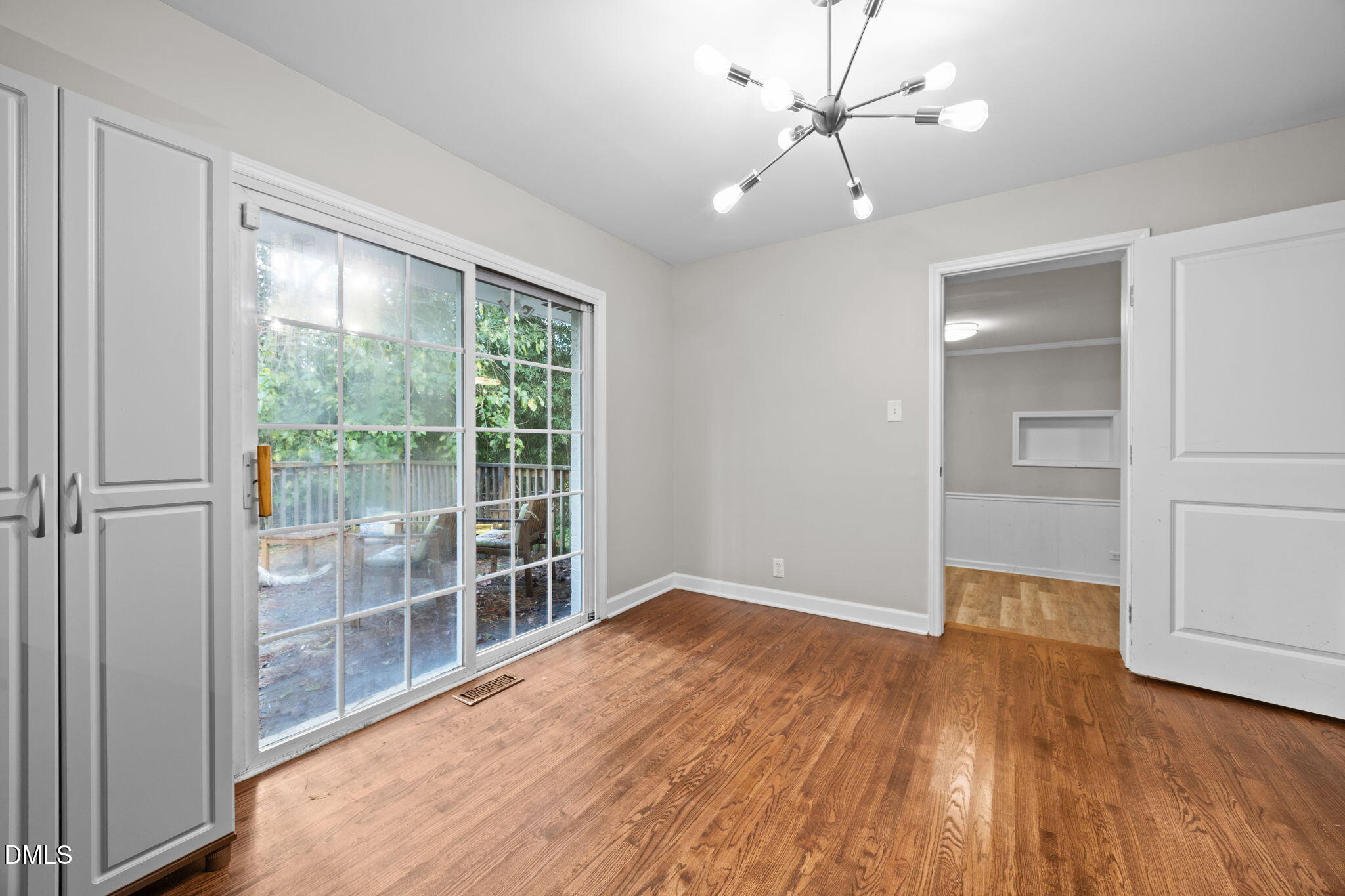 2950 Glenridge Drive Raleigh, NC 27604 - Photo 15 of 53 wooden floor in an empty room with a window