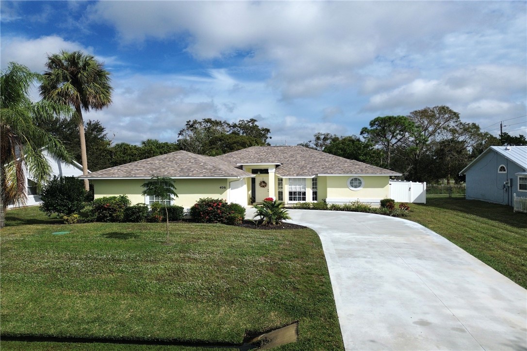 406 Perch Lane Sebastian, FL 32958 - Photo 1 of 27 a front view of a house with a yard
