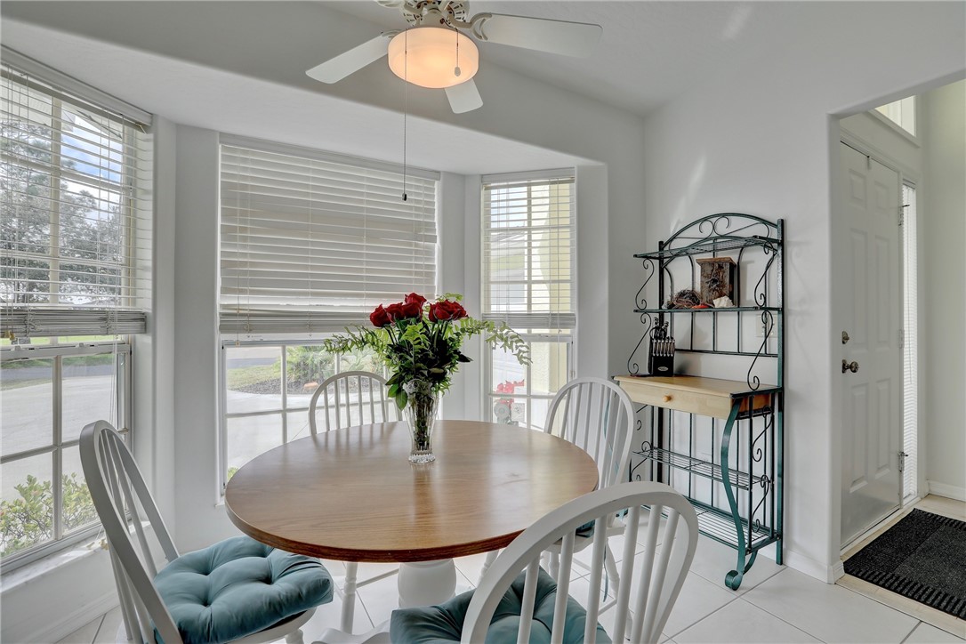 406 Perch Lane Sebastian, FL 32958 - Photo 12 of 27 a dining room with furniture and window