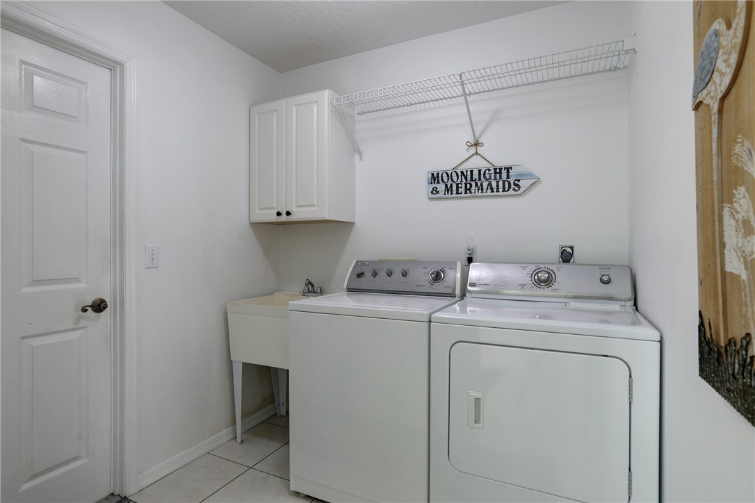406 Perch Lane Sebastian, FL 32958 - Photo 19 of 27 a view of storage and utility room with washer and dryer