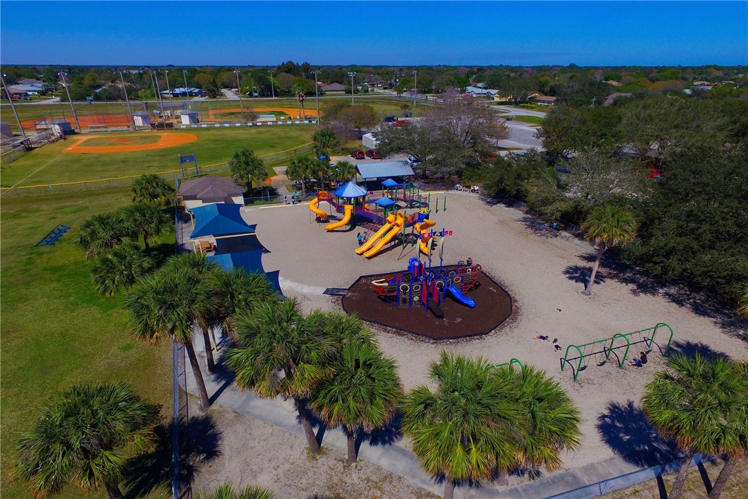 406 Perch Lane Sebastian, FL 32958 - Photo 24 of 27 an aerial view of a house with a garden and lake view