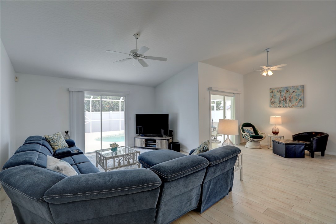 406 Perch Lane Sebastian, FL 32958 - Photo 4 of 27 a living room with furniture and a flat screen tv