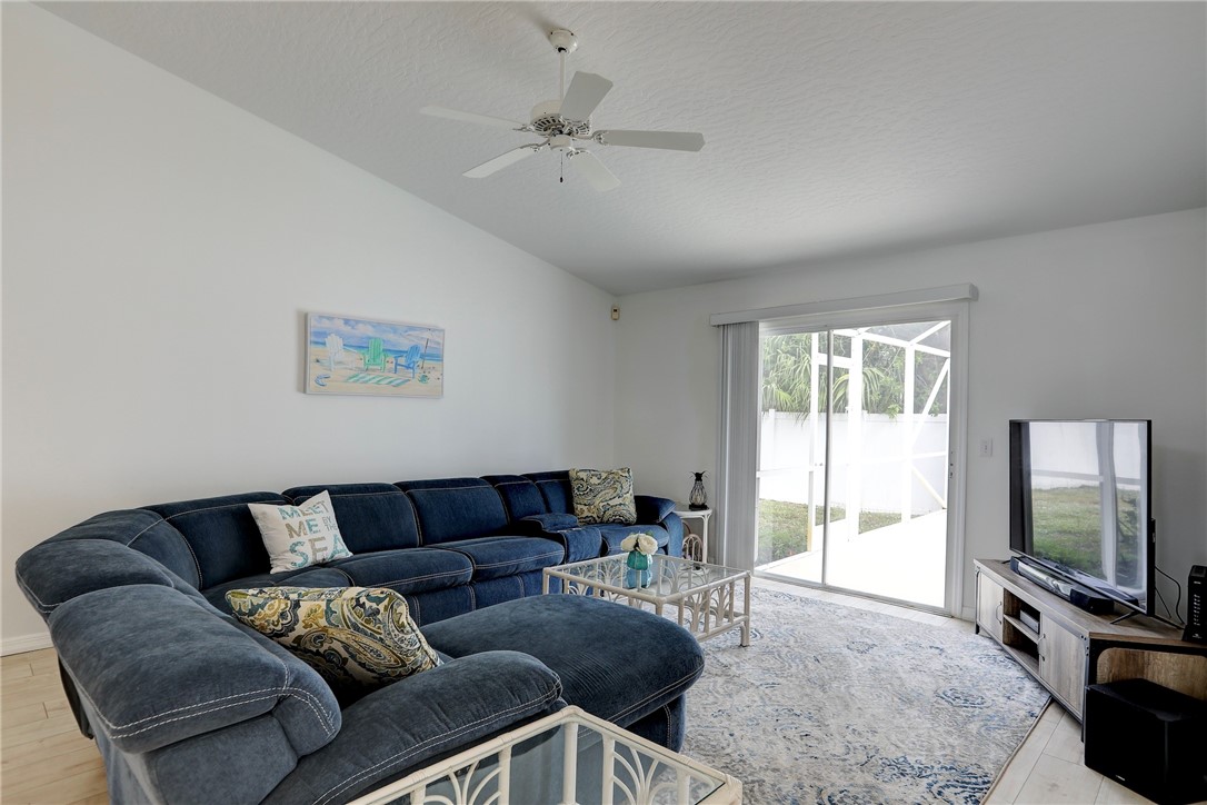 406 Perch Lane Sebastian, FL 32958 - Photo 5 of 27 a living room with furniture and a flat screen tv