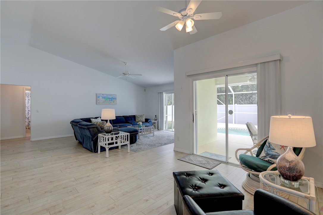 406 Perch Lane Sebastian, FL 32958 - Photo 7 of 27 a living room with furniture and a window