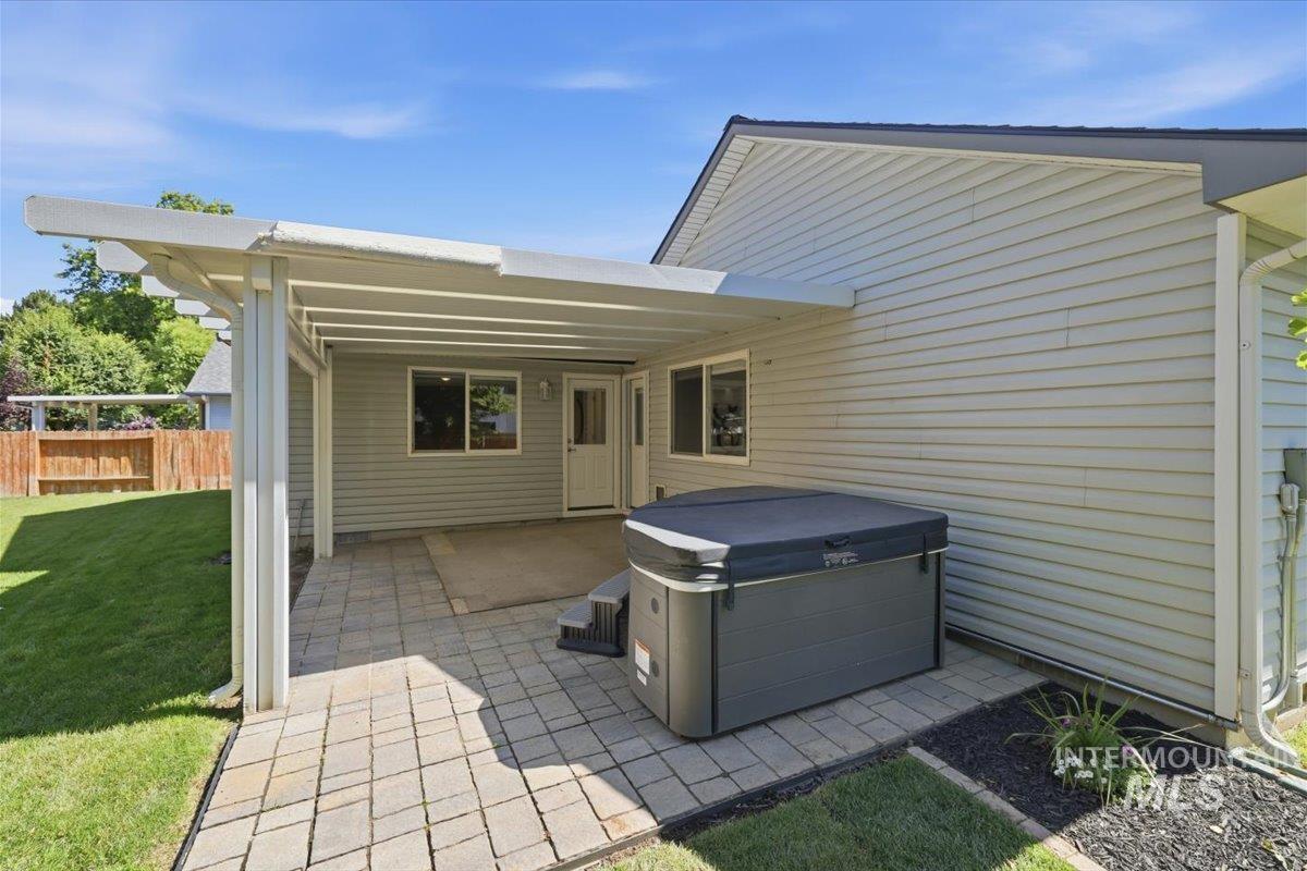2075 North Springland Place Boise, ID 83713 - Photo 38 of 49 Covered patio with a paver stone walkway and an integrated spa
