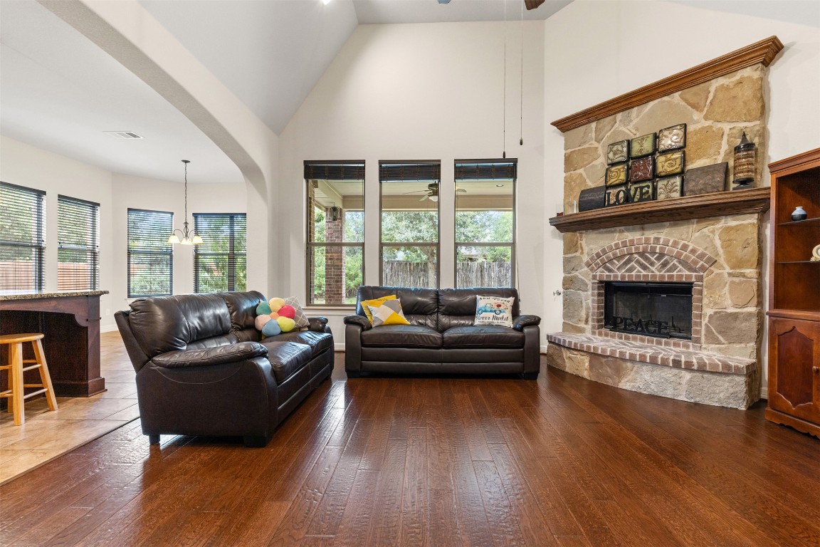 1916 Buffalo Speedway Leander, TX 78641 - Photo 11 of 30 a living room with furniture and a fireplace