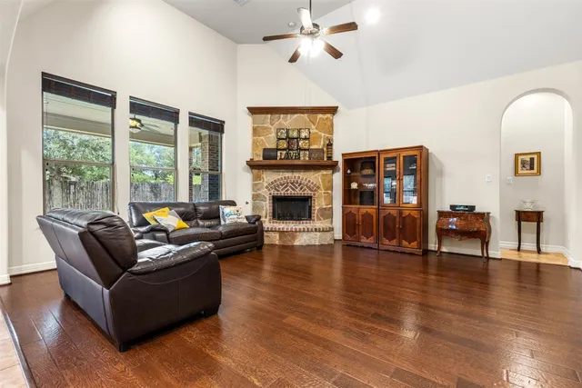a living room with furniture fireplace and flat screen tv