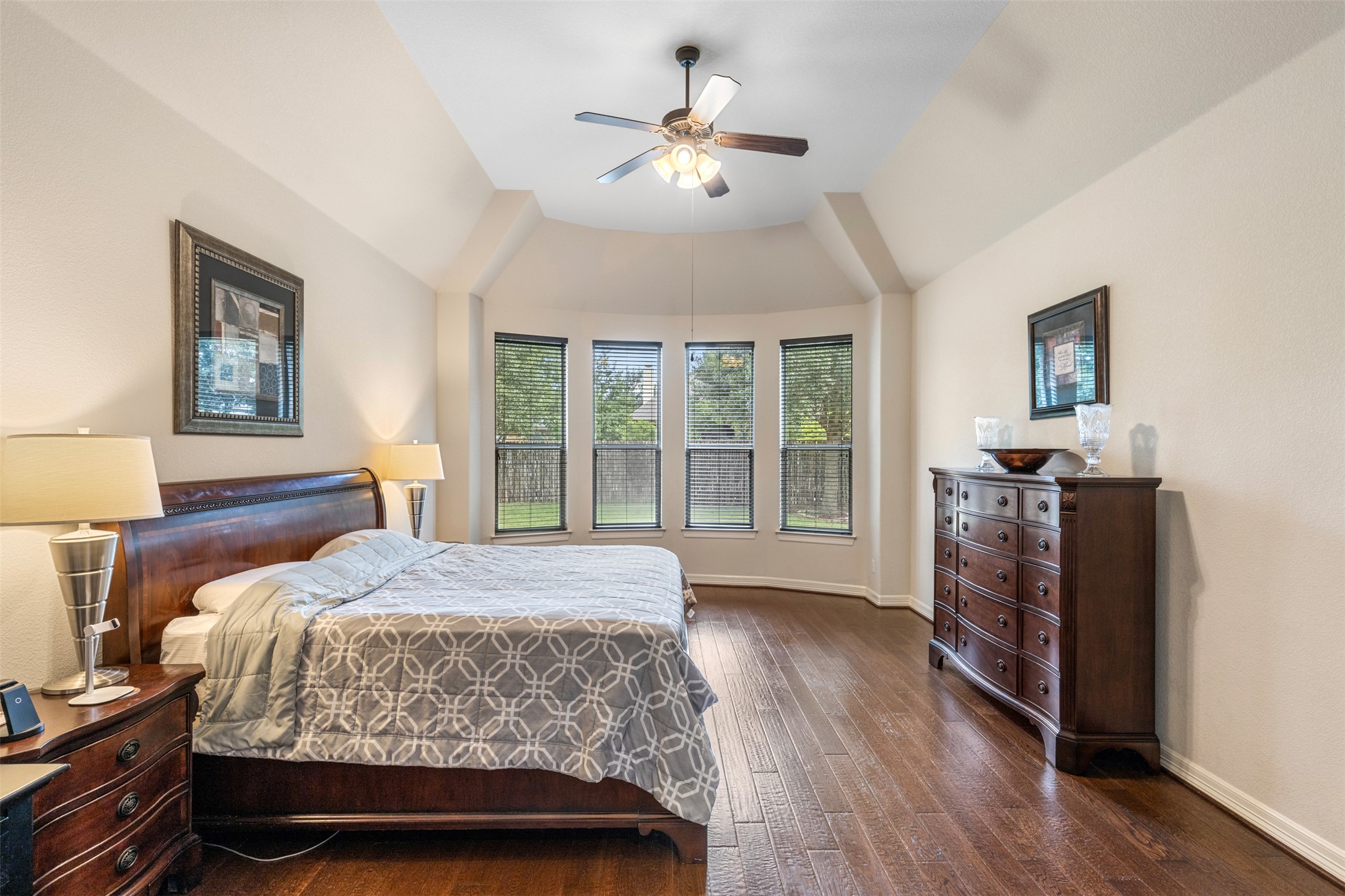 1916 Buffalo Speedway Leander, TX 78641 - Photo 17 of 31 a bedroom with a large bed and a chandelier fan