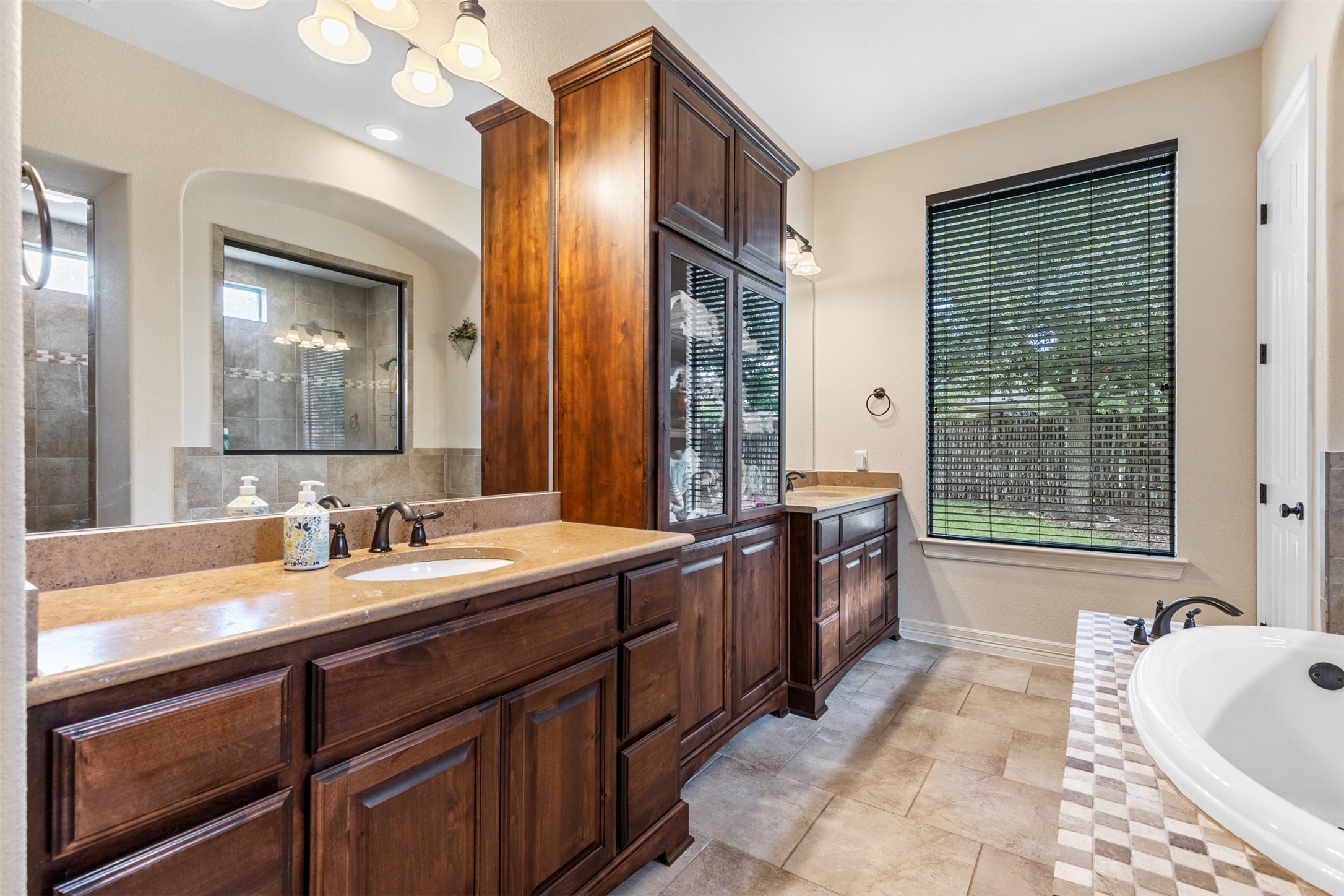 1916 Buffalo Speedway Leander, TX 78641 - Photo 19 of 31 a spacious bathroom with a tub sink and mirror