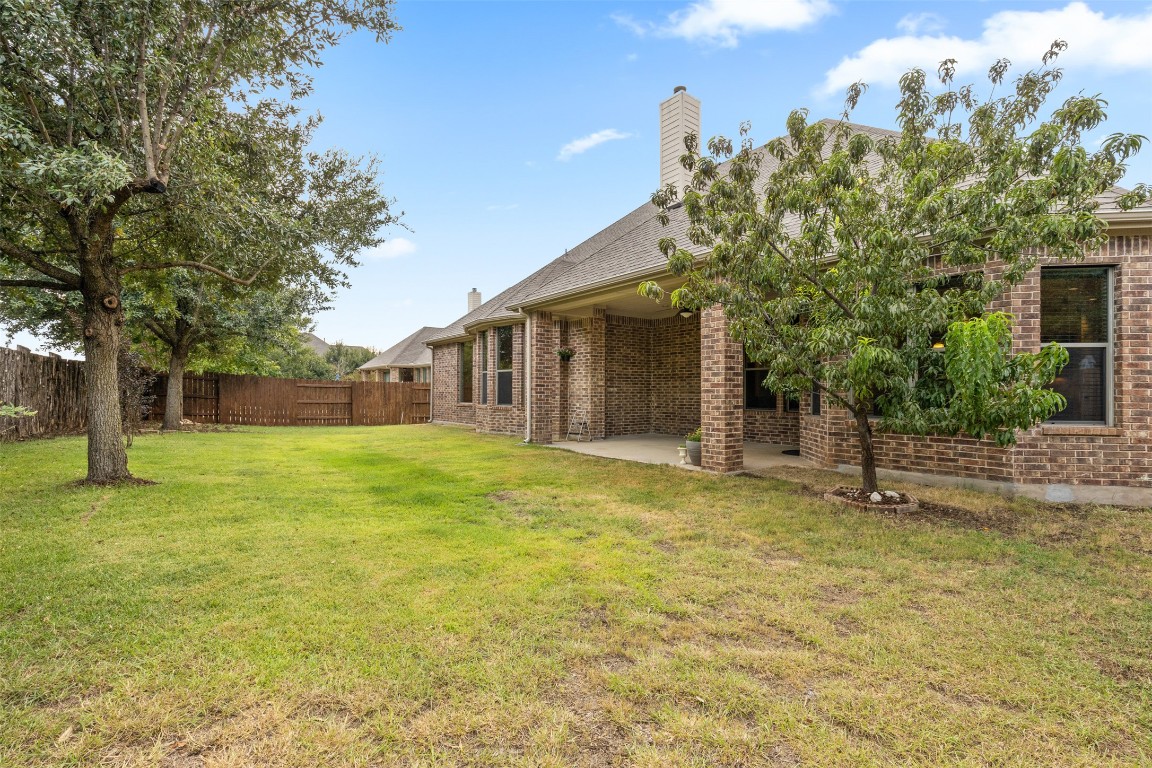 1916 Buffalo Speedway Leander, TX 78641 - Photo 27 of 30 a front view of a house with a yard