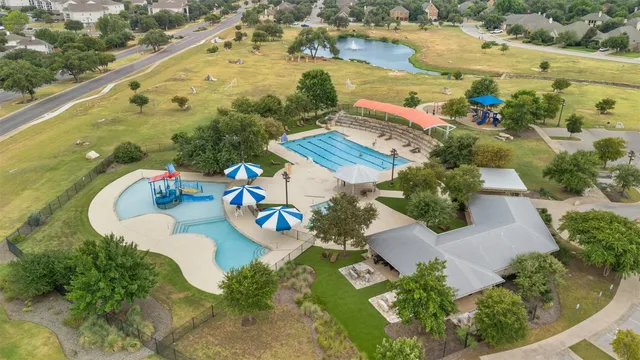 an aerial view of a house with outdoor space