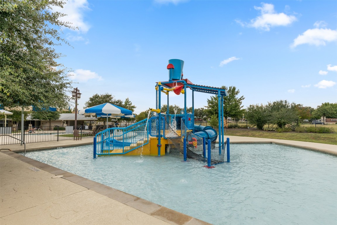 1916 Buffalo Speedway Leander, TX 78641 - Photo 30 of 30 a childrens park with lots of swings and slides