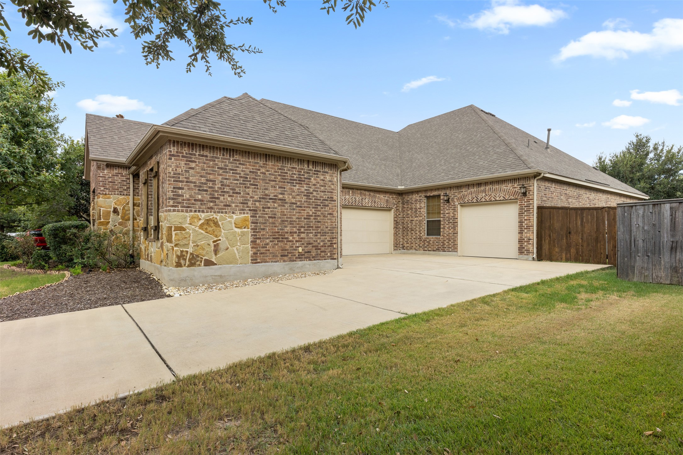 1916 Buffalo Speedway Leander, TX 78641 - Photo 3 of 31 a front view of a house with a yard and garage