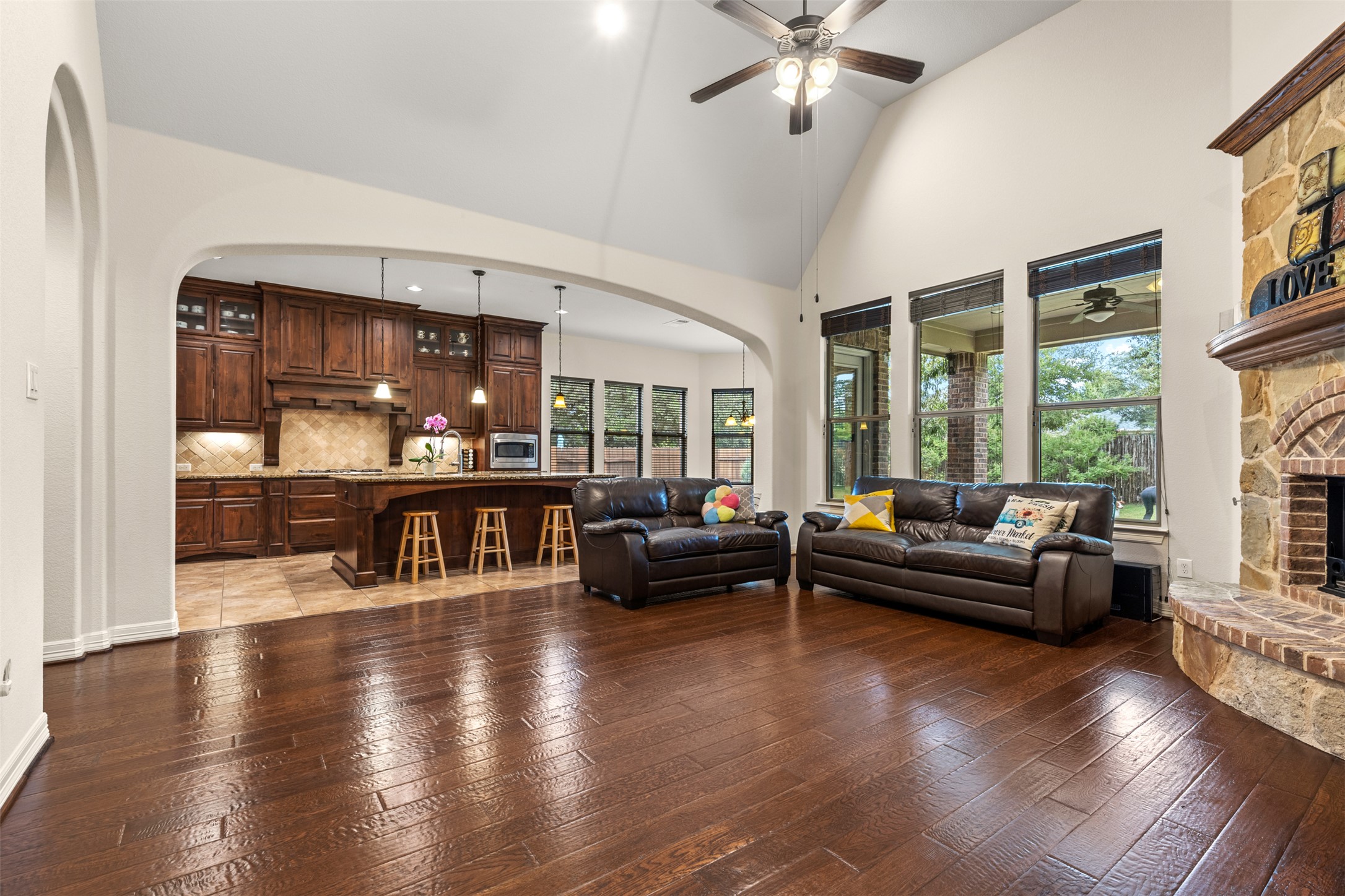 1916 Buffalo Speedway Leander, TX 78641 - Photo 10 of 31 a living room with fireplace furniture and a large window