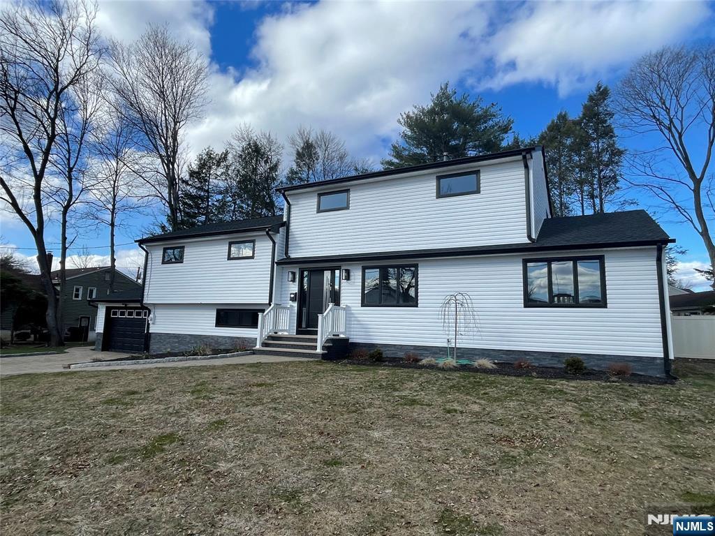 a house view with a backyard space