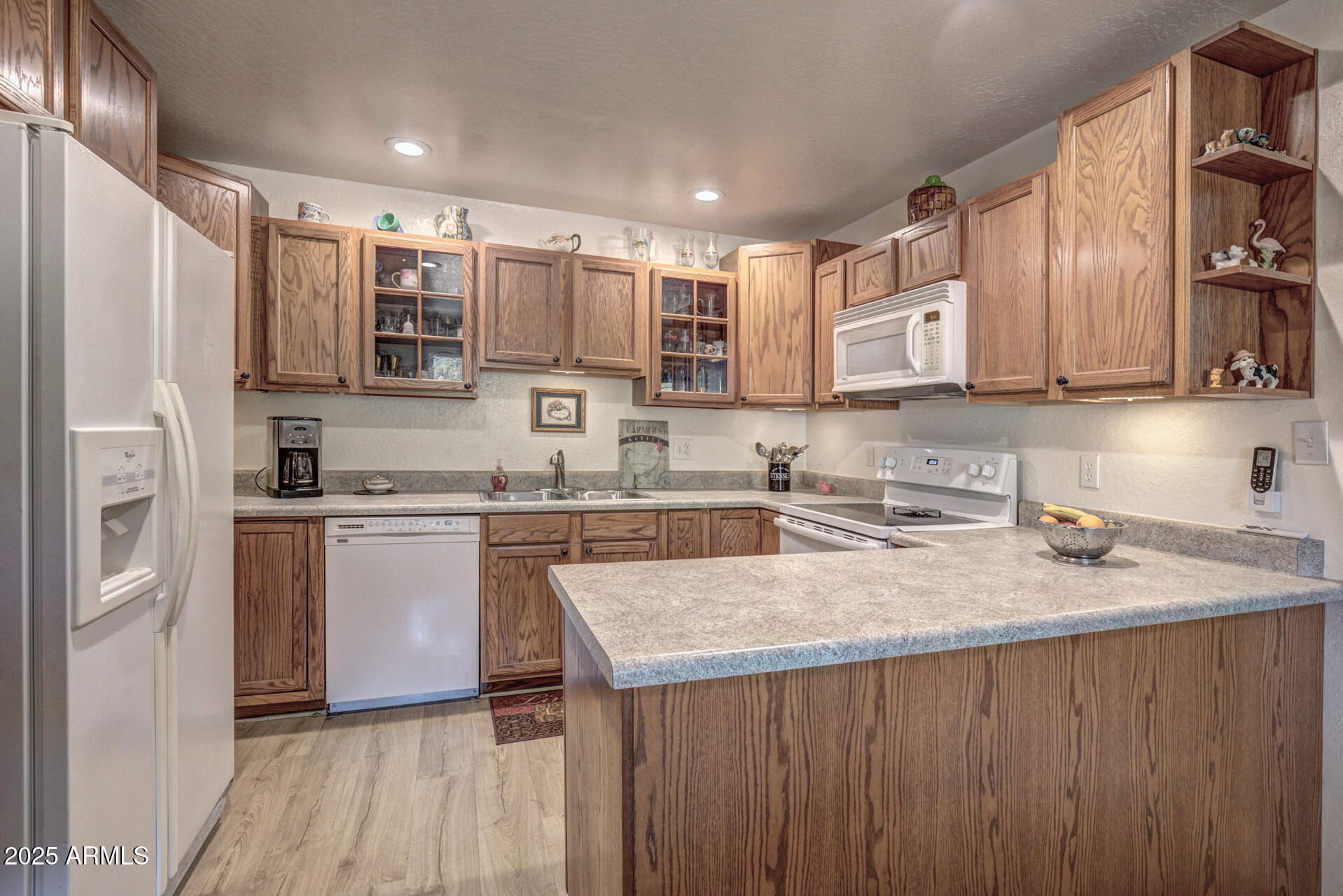 9019 Pinon Lane Pine, AZ 85544 - Photo 7 of 34 a kitchen with stainless steel appliances granite countertop a sink stove and refrigerator