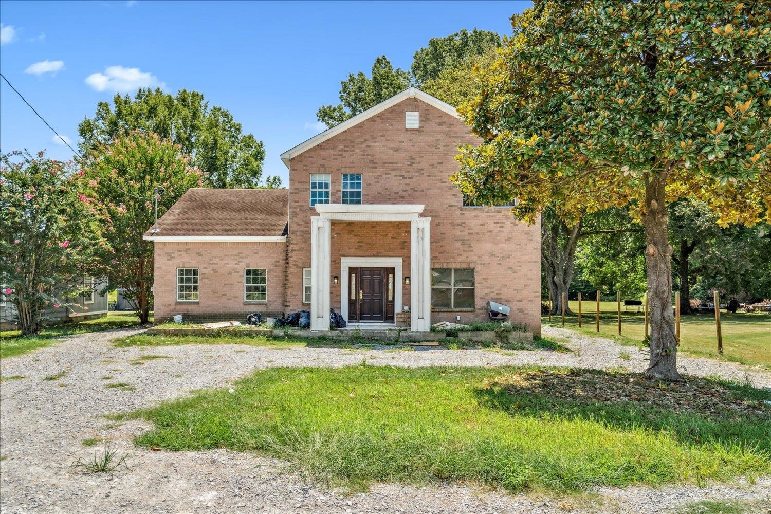 7723 Reese Road Memphis, TN 38133 - Photo 2 of 33 a front view of a house with a yard