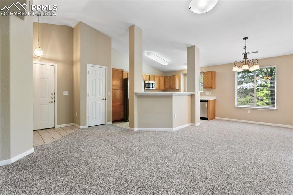 3831 Riviera Grove, Unit 204 Colorado Springs, CO 80922 - Photo 13 of 35 a view of an empty room with a window