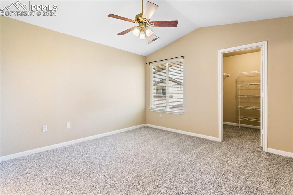 3831 Riviera Grove, Unit 204 Colorado Springs, CO 80922 - Photo 19 of 35 an empty room with windows and fan